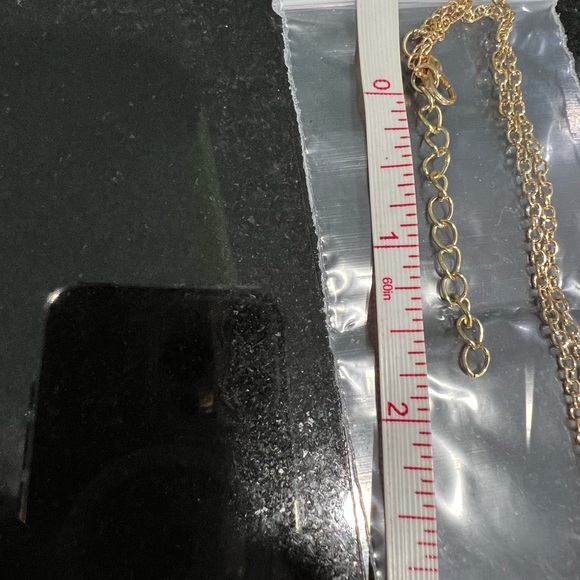 HAMSA IN GOLD TONE FILIGREE WITH A TURQUOISE COLORED STONE - Picture 5 of 8